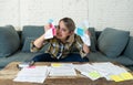 Close up of stressed and overwhelmed young woman trying to manage home finances paying bills Royalty Free Stock Photo