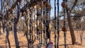 Close up of strings of African necklaces made from beads and seeds on display at an outdoor market in Namibia. Background blurred Royalty Free Stock Photo