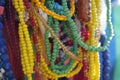 Close up of strings of colorful glass beads.  Background partly out of focus or blurred Royalty Free Stock Photo