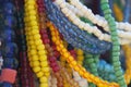 Close up of strings of colorful glass beads.  Background partly out of focus or blurred Royalty Free Stock Photo