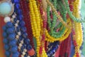 Close up of strings of colorful glass beads. Background partly out of focus or blurred Royalty Free Stock Photo