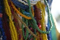 Close up of strings of colorful glass beads. Background partly out of focus or blurred Royalty Free Stock Photo