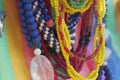 Close up of strings of colorful glass beads. Background partly out of focus or blurred Royalty Free Stock Photo