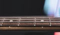 Close-up of strings on the fretboard of a bass guitar Royalty Free Stock Photo
