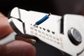 Close-up of a stripped ground wire by a wire stripper Royalty Free Stock Photo