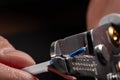 Close-up of a stripped ground wire by a wire stripper Royalty Free Stock Photo