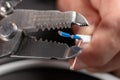 Close-up of a stripped ground wire by a wire stripper Royalty Free Stock Photo