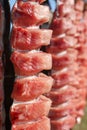 Close up of strips of filleted and cut salmon drying on racks. Royalty Free Stock Photo