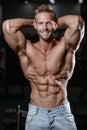 Close up strong abs guy showing in the gym muscles Royalty Free Stock Photo