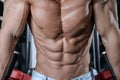 Close up strong abs guy showing in the gym muscles Royalty Free Stock Photo