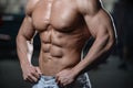 Close up strong abs guy showing in the gym muscles Royalty Free Stock Photo