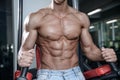 Close up strong abs guy showing in the gym muscles Royalty Free Stock Photo