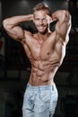 Close up strong abs guy showing in the gym muscles Royalty Free Stock Photo