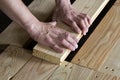 Close up of strong muscular hands of professional carpenter inst