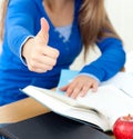 Close up of a student doing thumbs up