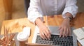 Close up of student girl hands comparing notes on digital tablet sitting on a desk. female using tablet at cafe. business finance Royalty Free Stock Photo