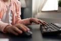 Close up of student hand typing on computer keyboard Royalty Free Stock Photo