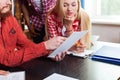 Close Up Student High School Group Looking At Paper Document With Professor Sitting At Desk, Young People Teacher Royalty Free Stock Photo