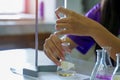 Close-up of a student performing an acid-base titration experiment. Royalty Free Stock Photo