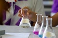 Close-up of a student performing an acid-base titration experiment. Royalty Free Stock Photo