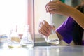 Close-up of a student performing an acid-base titration experiment. Royalty Free Stock Photo