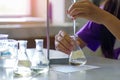 Close-up of a student performing an acid-base titration experiment. Royalty Free Stock Photo