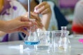 Close-up of a student performing an acid-base titration experiment. Royalty Free Stock Photo