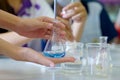 Close-up of a student performing an acid-base titration experiment. Royalty Free Stock Photo