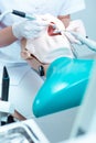 Close-up of student working with dental drill