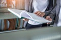 Close up students reading book in library, studying and learning knowledge Royalty Free Stock Photo