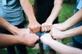 Close up of students standing hands making fist bump Royalty Free Stock Photo