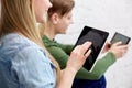 Close up of students with tablet pc at school