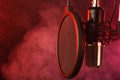 Close-up. Studio condenser microphone Radio, vocals, podcasts red smoke. Copy space