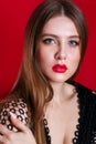 Close-up studio portrait of beautiful woman with bright make-up and red lips Royalty Free Stock Photo