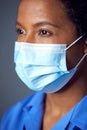 Close Up Studio Portrait Of Female Nurse Wearing Uniform And Face Mask Royalty Free Stock Photo