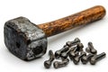 Heavy Black Sledge Hammer with Wooden Handle Alongside Black Metal Dumbbell Weights Royalty Free Stock Photo