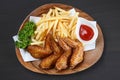 Fried chicken wings with french fries Royalty Free Stock Photo