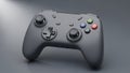 Gray Wireless Video Game Controller with Colorful Buttons on Dark Surface gaming console Royalty Free Stock Photo