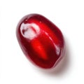 Single Shiny Red Pomegranate Seed with Natural Texture Isolated on White Background Studio Lighting Royalty Free Stock Photo
