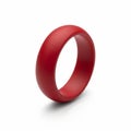 A single matte red silicone wedding ring on a white background band jewelry Royalty Free Stock Photo