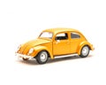 Close-up studio shot small orange toy car isolated on white Royalty Free Stock Photo