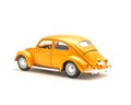 Close-up studio shot small orange toy car isolated on white Royalty Free Stock Photo