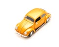 Close-up studio shot small orange toy car isolated on white Royalty Free Stock Photo