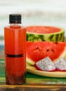 Close up studio shot of sweet delicious healthy sliced watermelon and fresh ripe cold dragon fruit juice in glass placed on wood Royalty Free Stock Photo