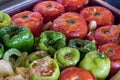 Close-up of stuffed peppers and tomatoes - greek gemista placed on an oven tray. Royalty Free Stock Photo