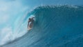 CLOSE UP: Stunning emerald water curls over surfer riding inside a barrel wave Royalty Free Stock Photo