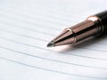 Close up.stylish ballpoint pen on notebook sheet Royalty Free Stock Photo