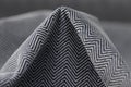 Stylish black and grey herringbone fabric texture background Royalty Free Stock Photo