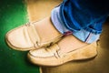 Close up of stylish female shoes. Outdoor fashion shoes footwear concept,Woman`s legs in blue jeans. Royalty Free Stock Photo