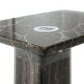 Close Up of a Stylish Modern Marble Side Table with a Sleek Rectangular Top and a Cylindrical Base, Showcasing Elegant Veins and a Royalty Free Stock Photo